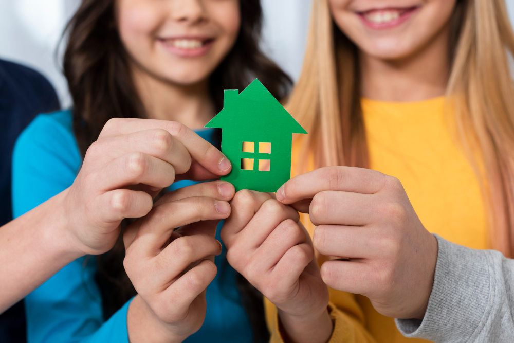 close-up-kids-holding-toy-house.jpg