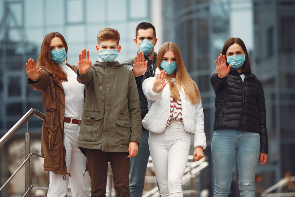 people-wearing-protective-masks-are-showing-stop-sign-by-hands-1.jpg